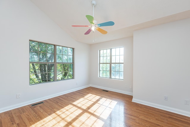 unfurnished room featuring ceiling fan, wood-type flooring, and high vaulted ceiling