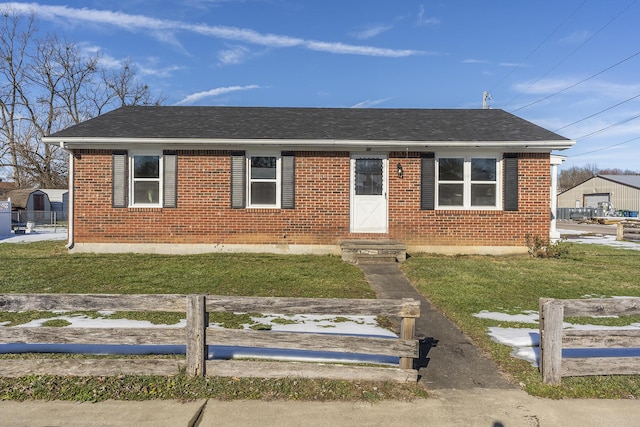 view of front of home featuring a front lawn