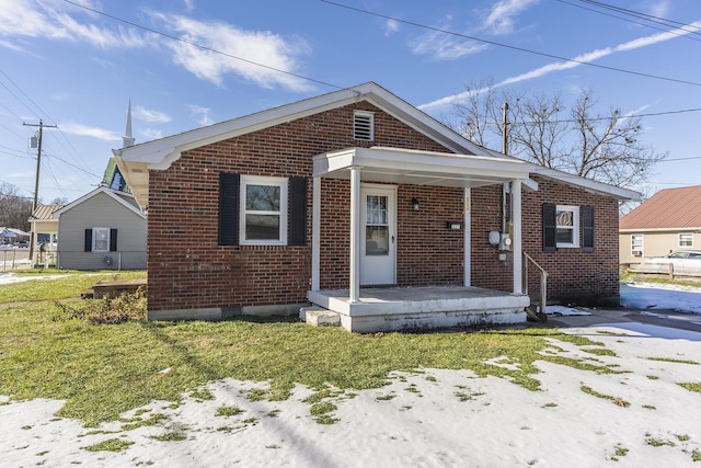 bungalow-style house with a front yard