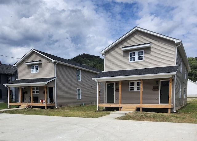 view of front of house featuring a front lawn and a porch