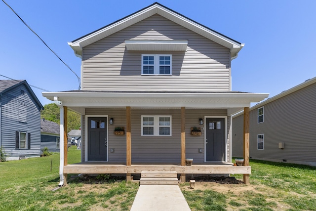 view of front of home with a front lawn and a porch