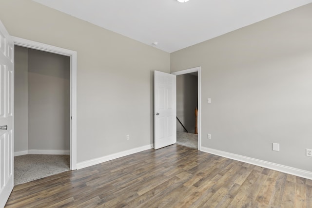 unfurnished bedroom featuring hardwood / wood-style flooring