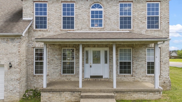 doorway to property with a porch