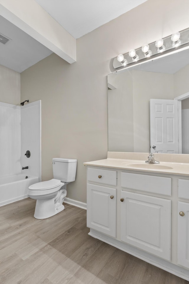 full bathroom with toilet, shower / bath combination, wood-type flooring, and vanity