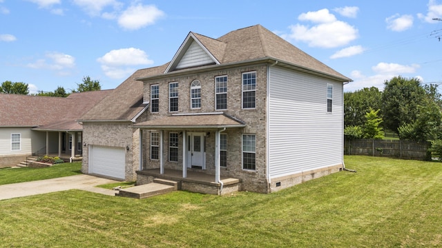 view of front of home with a garage, covered porch, and a front yard