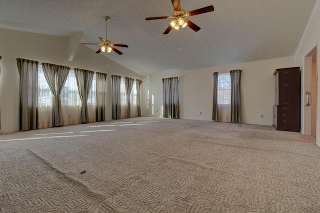 unfurnished room featuring ceiling fan, lofted ceiling, and light carpet