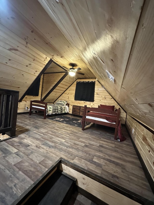 bedroom with wood ceiling, lofted ceiling, wooden walls, and hardwood / wood-style flooring