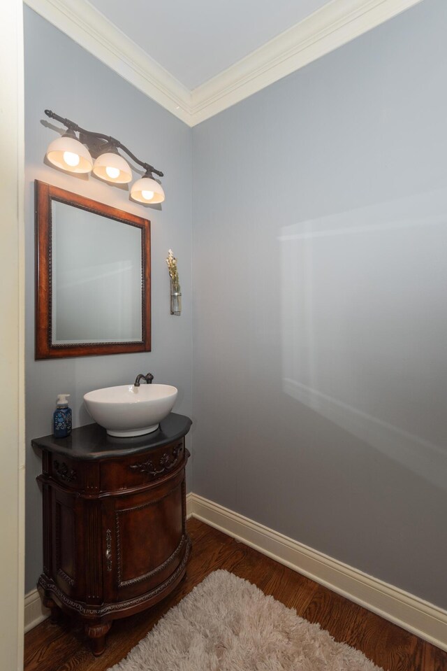 bathroom with plus walk in shower, crown molding, and hardwood / wood-style flooring