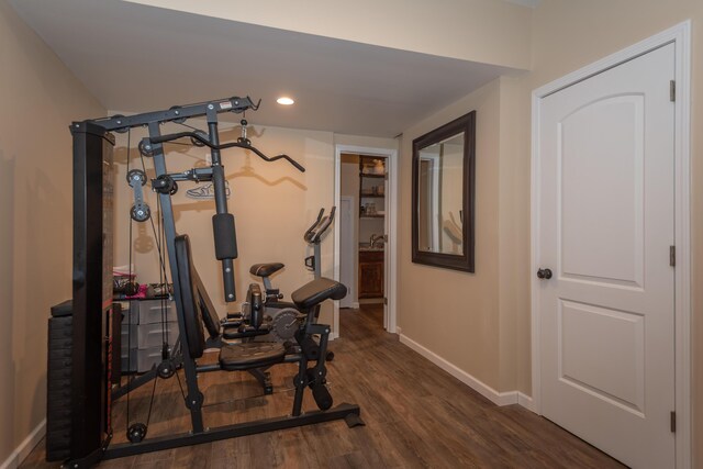 bathroom with ornamental molding, hardwood / wood-style floors, and vanity