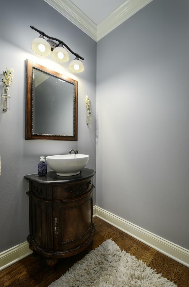 6028 Crabapple Rd, Versailles, KY 40383 - bathroom with vanity, wood finished floors, baseboards, and ornamental molding
