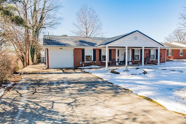 ranch-style house with a garage and a porch