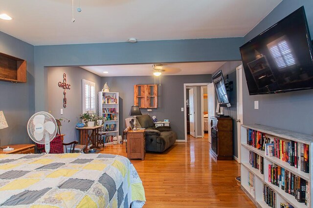 bedroom with light wood-style flooring and baseboards