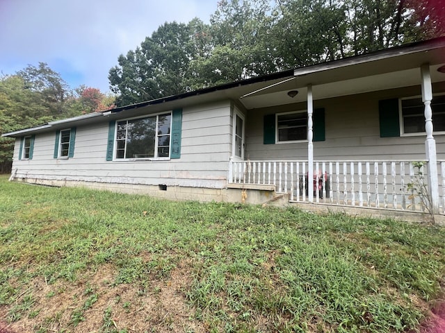 view of side of home featuring a yard