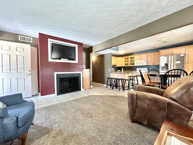 tiled living room with a textured ceiling