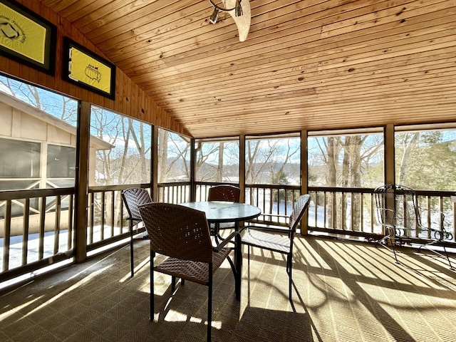 sunroom with vaulted ceiling and wooden ceiling