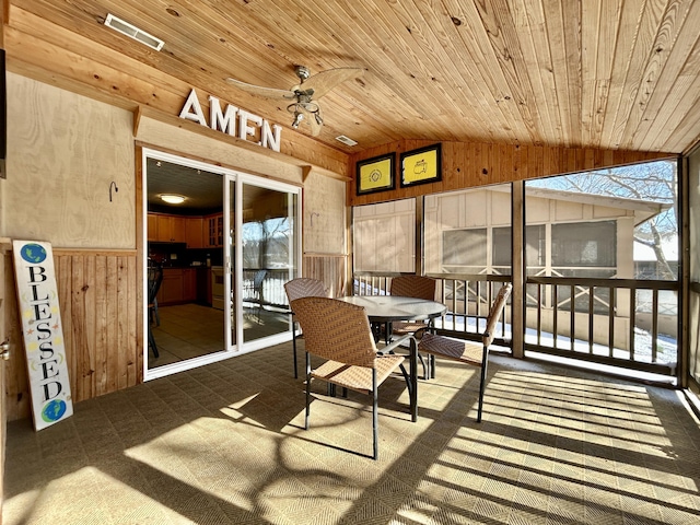 sunroom / solarium featuring ceiling fan, wooden ceiling, and vaulted ceiling