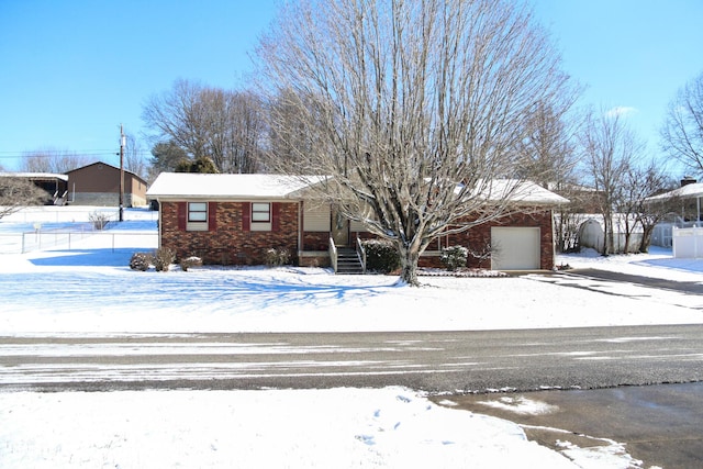 ranch-style house featuring a garage