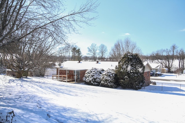 view of yard covered in snow