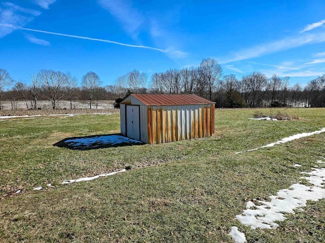 exterior space with a rural view and a storage shed