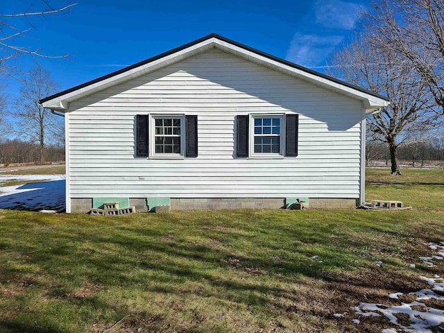 view of home's exterior featuring a yard