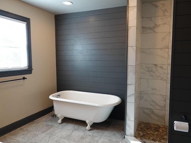 bathroom featuring plus walk in shower and wood walls