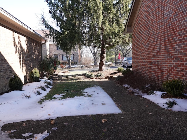 view of yard layered in snow