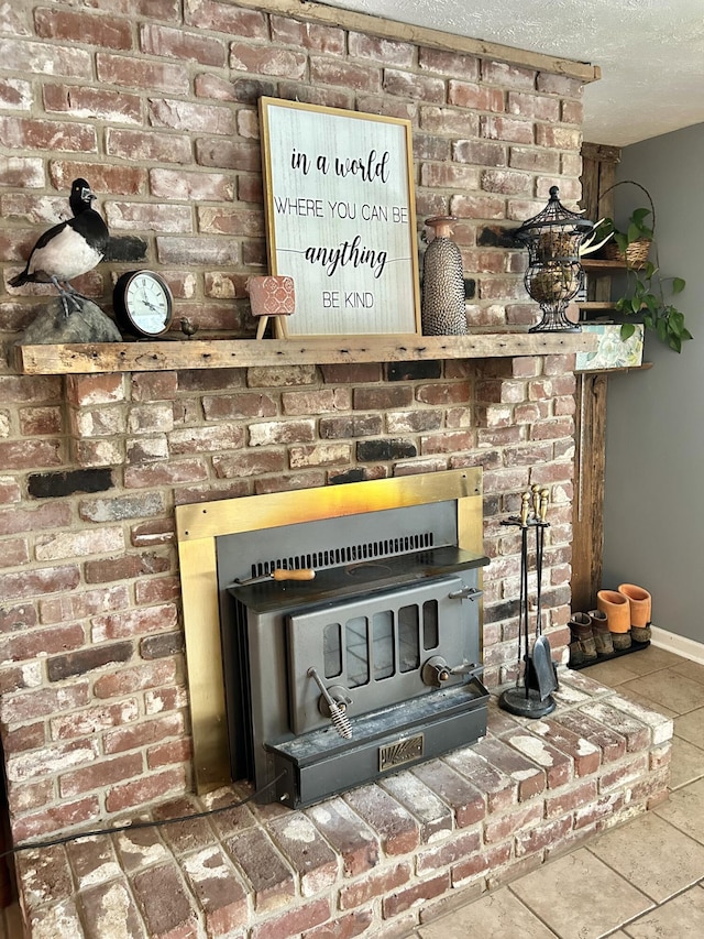 interior details featuring a fireplace and a textured ceiling