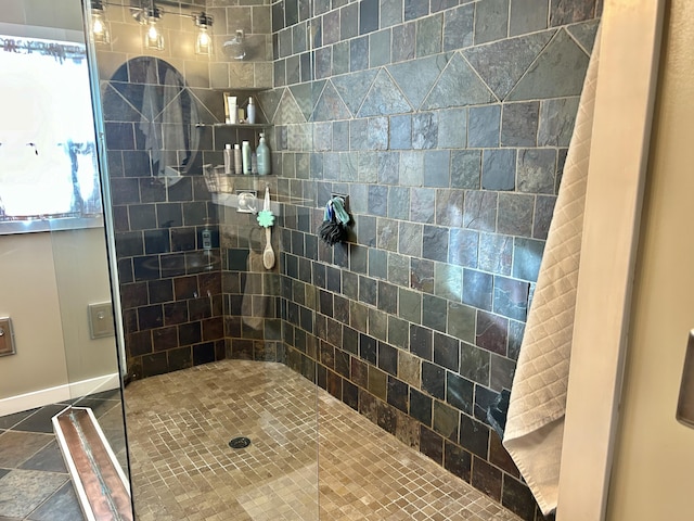 bathroom with tiled shower