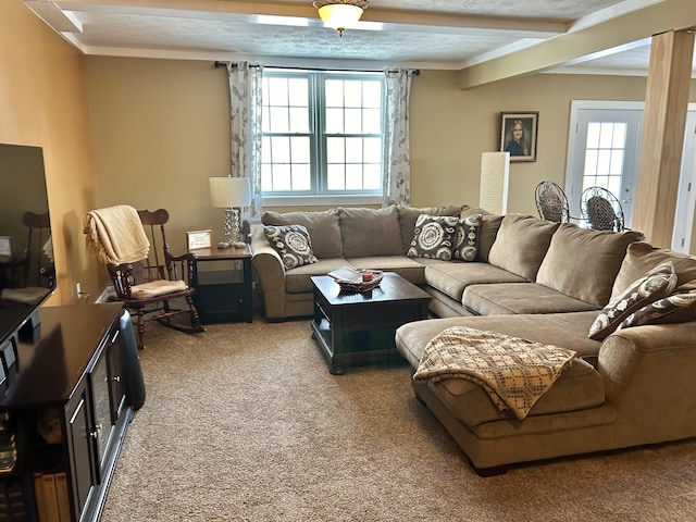 carpeted living room with beam ceiling and ornamental molding