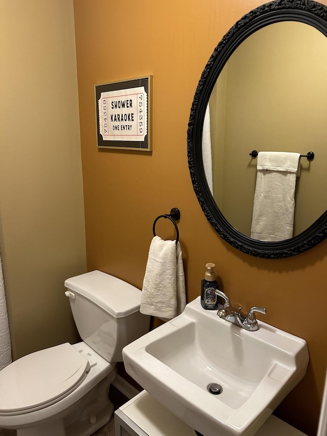 bathroom featuring sink and toilet