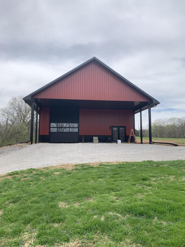 view of outdoor structure featuring a lawn