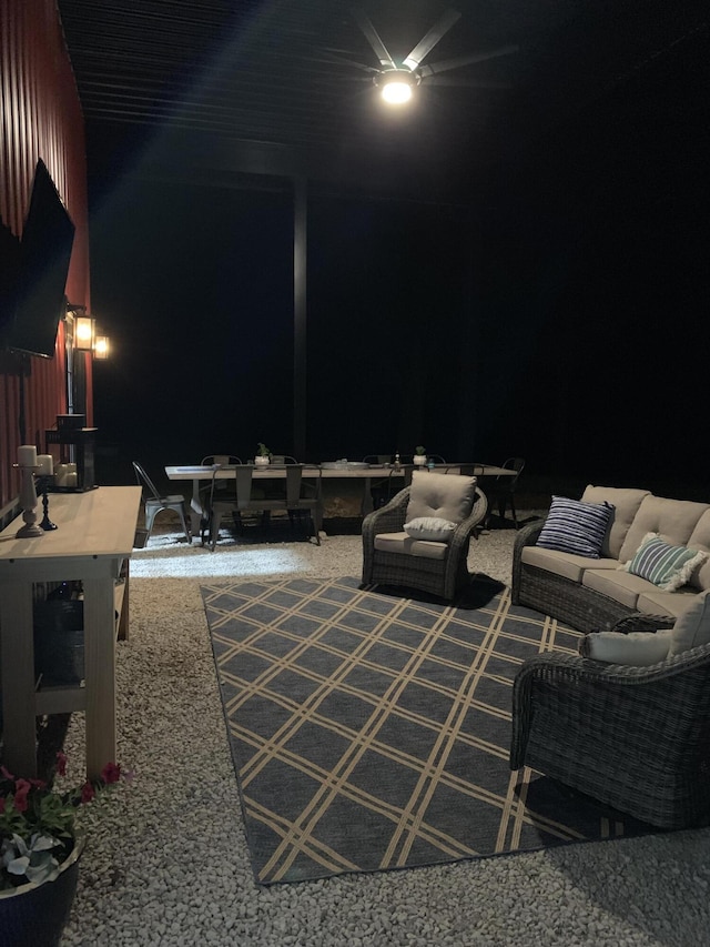 patio at night featuring an outdoor living space