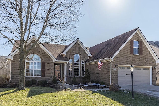 view of front of house with a garage and a front lawn