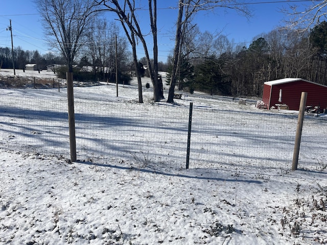 view of yard layered in snow