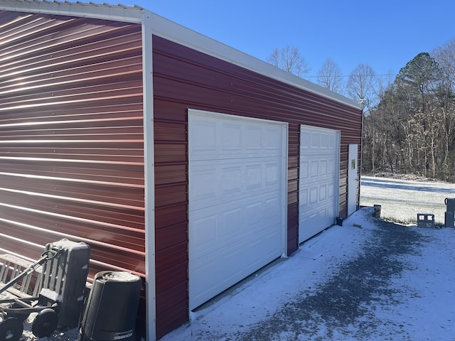 view of snow covered garage