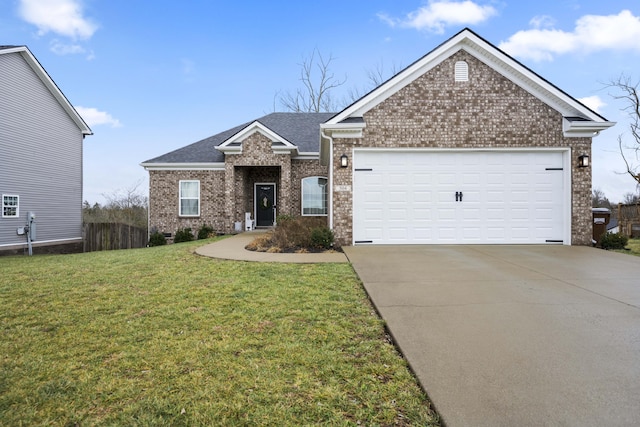 view of front of house featuring a garage and a front lawn