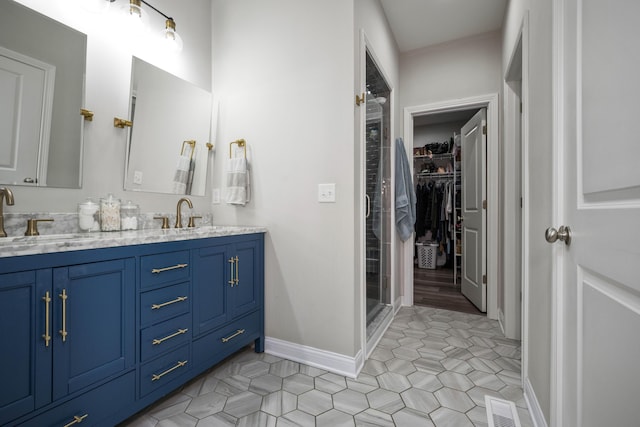 bathroom featuring tile patterned flooring and vanity