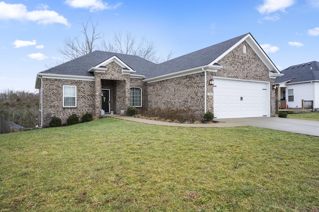 view of front of house with a garage and a front lawn