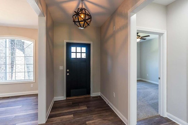 foyer with dark hardwood / wood-style flooring