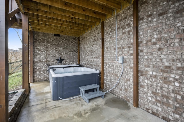 view of patio / terrace with a hot tub