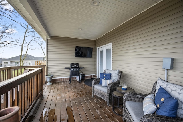 wooden deck with grilling area