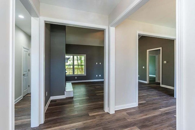 hallway with dark wood-type flooring