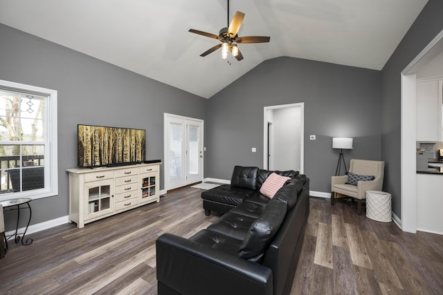 living room with ceiling fan, lofted ceiling, and dark hardwood / wood-style floors