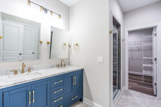 bathroom with vanity and an enclosed shower