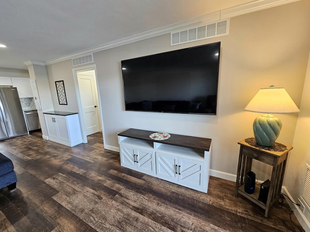 living room featuring ornamental molding and dark hardwood / wood-style floors