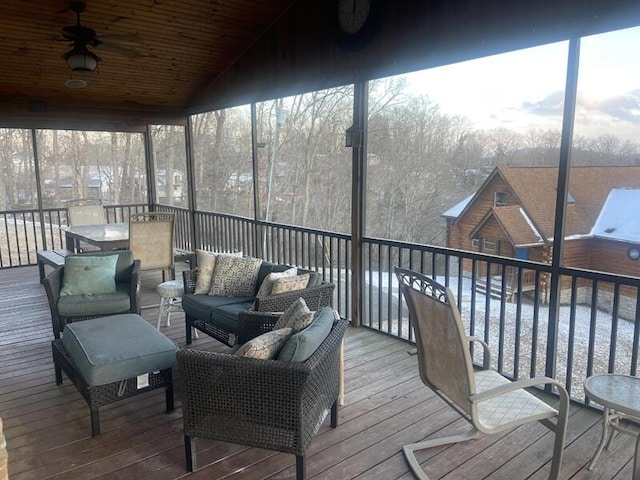 sunroom featuring lofted ceiling, a wealth of natural light, wood ceiling, and ceiling fan