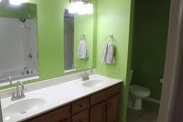 bathroom with vanity, tile patterned floors, and toilet