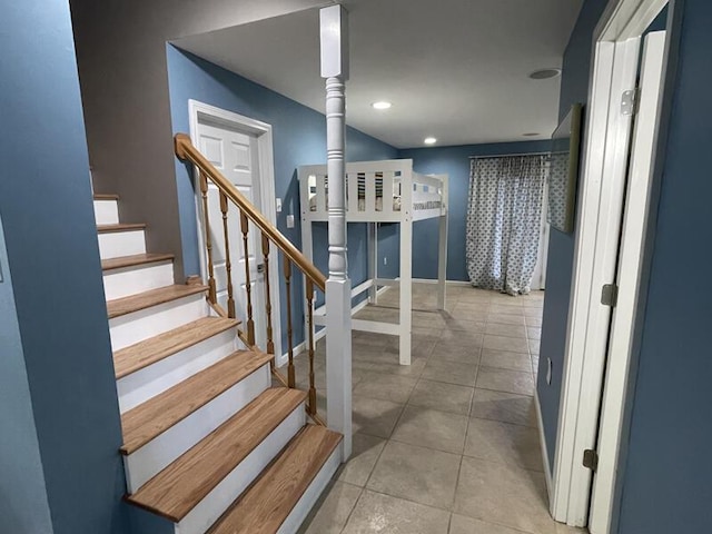 staircase with tile patterned flooring