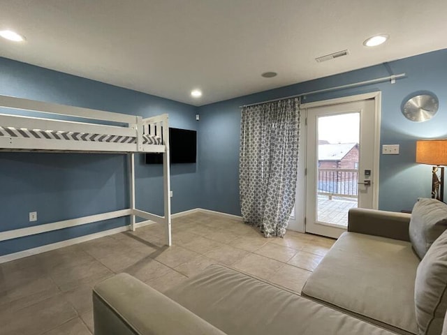 bedroom with tile patterned flooring and access to outside