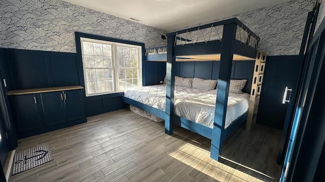 bedroom with hardwood / wood-style flooring